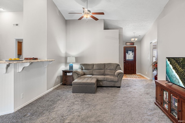 living area with visible vents, a textured ceiling, baseboards, and carpet floors