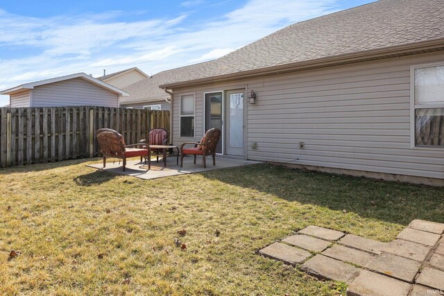 view of yard featuring a patio and fence