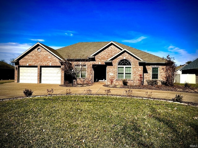 ranch-style home featuring concrete driveway, an attached garage, brick siding, and a front yard