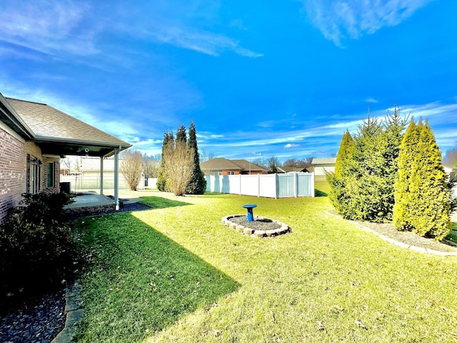 view of yard featuring a patio and fence