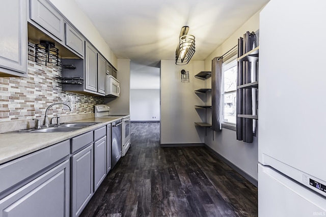 kitchen with gray cabinets, open shelves, a sink, range with electric stovetop, and white microwave