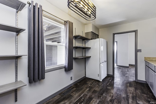 kitchen with open shelves, a healthy amount of sunlight, gray cabinets, and freestanding refrigerator