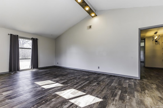 empty room featuring vaulted ceiling with beams, wood finished floors, visible vents, and baseboards