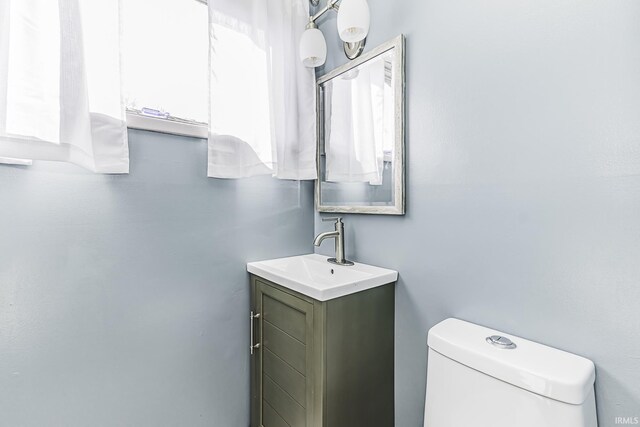 bathroom with toilet and vanity