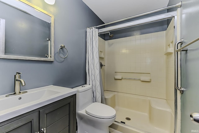 bathroom featuring vanity, toilet, and a shower with shower curtain