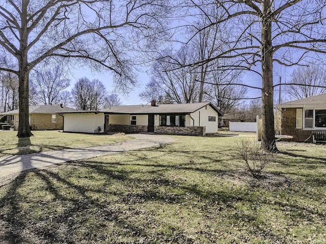 view of front of house featuring driveway and a chimney