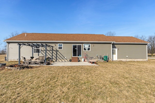 back of property featuring a patio, roof with shingles, a pergola, entry steps, and a lawn