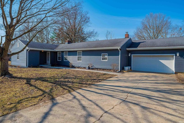 single story home featuring an attached garage, driveway, and a chimney