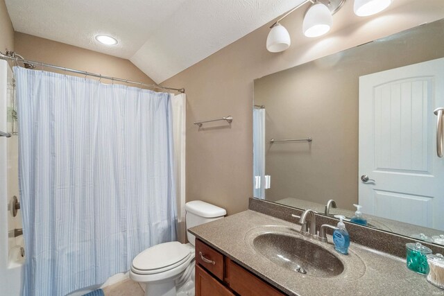 bathroom featuring toilet, shower / bath combo, a textured ceiling, vanity, and vaulted ceiling