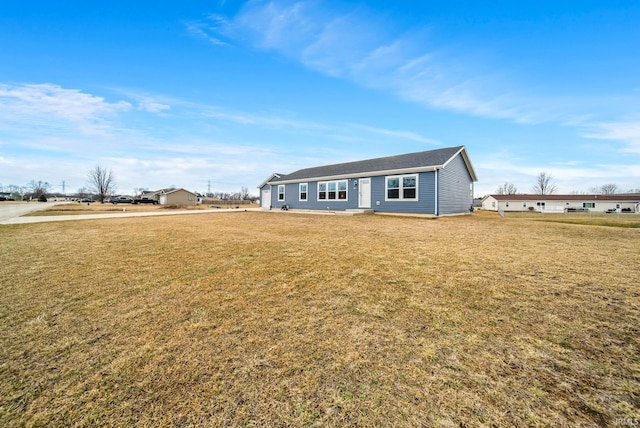 ranch-style house featuring a front lawn