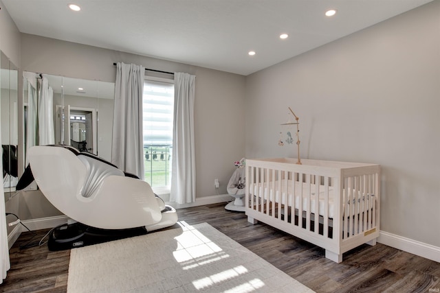 bedroom featuring recessed lighting, wood finished floors, and baseboards