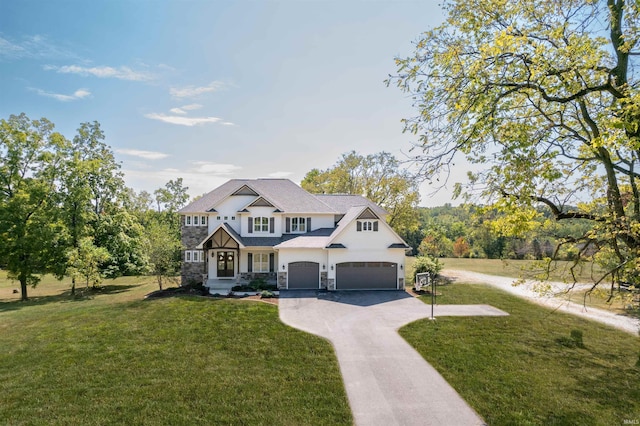 view of front of property with a front lawn, an attached garage, stone siding, and driveway