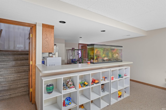 interior space with baseboards and carpet floors