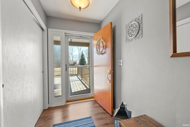 doorway to outside with wood finished floors