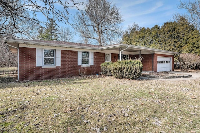 ranch-style home with a front yard, brick siding, and a garage