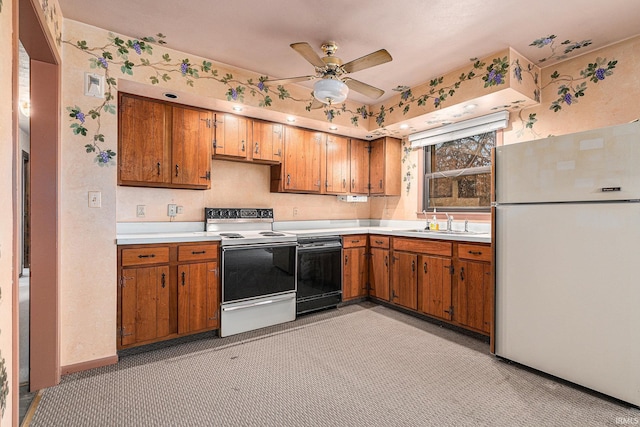 kitchen featuring white appliances, brown cabinetry, light countertops, and a sink