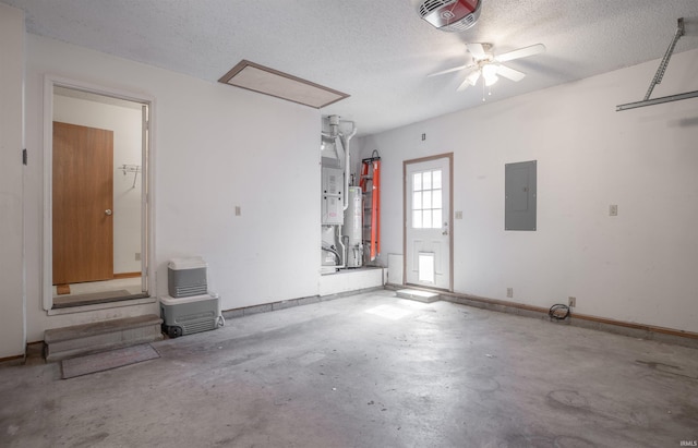 garage featuring electric panel, visible vents, gas water heater, and ceiling fan