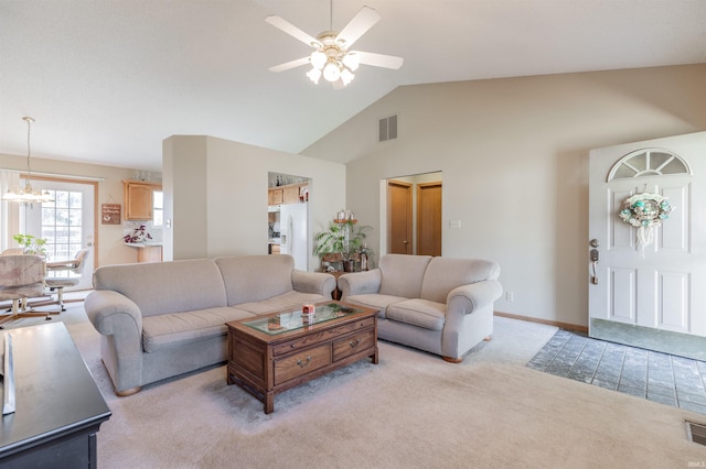 living room featuring visible vents, light colored carpet, ceiling fan with notable chandelier, and high vaulted ceiling