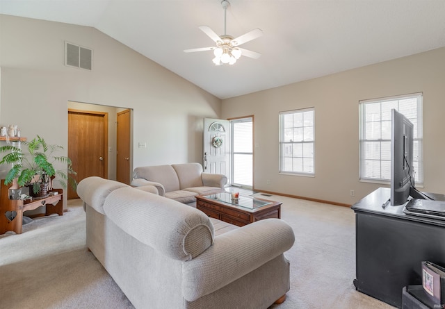 living area with visible vents, ceiling fan, baseboards, light carpet, and high vaulted ceiling