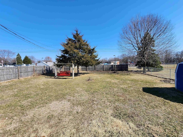 view of yard with a fenced backyard