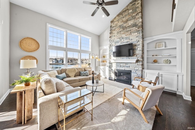 living room featuring a fireplace, a ceiling fan, dark wood-type flooring, and baseboards