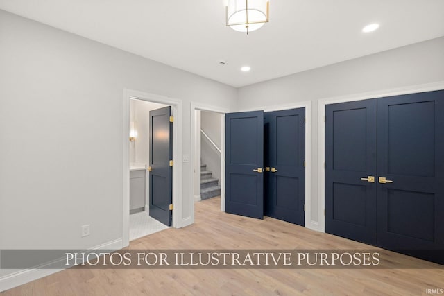 unfurnished bedroom featuring recessed lighting, baseboards, and wood finished floors