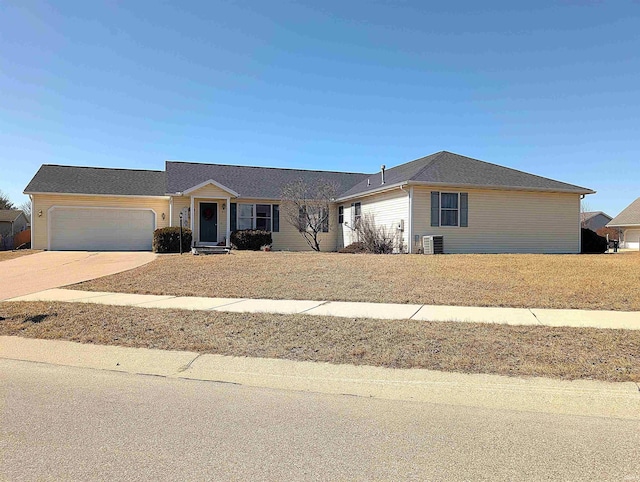 ranch-style house with an attached garage and driveway