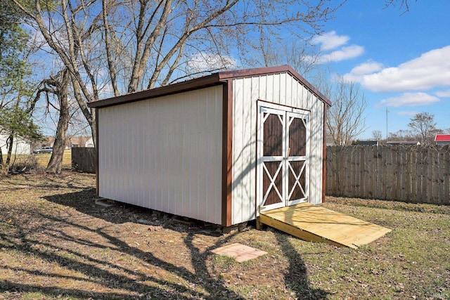 view of shed with fence