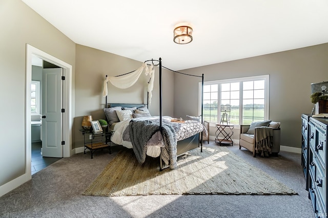 bedroom featuring carpet flooring and baseboards