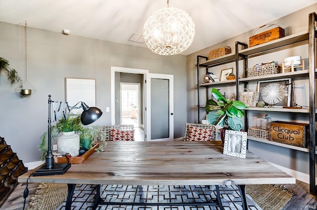 interior space featuring a chandelier and wood finished floors