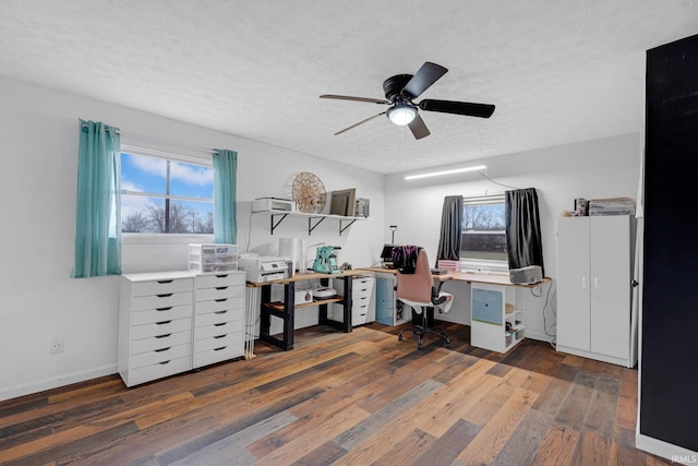 office space with ceiling fan, hardwood / wood-style flooring, baseboards, and a textured ceiling