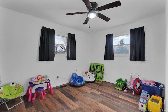 rec room featuring plenty of natural light, visible vents, baseboards, and wood finished floors