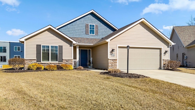 craftsman house with a shingled roof, a front yard, driveway, stone siding, and an attached garage