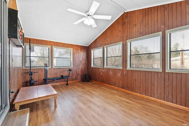 sunroom featuring a ceiling fan and lofted ceiling