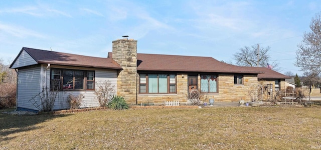 view of front of house featuring stone siding, a chimney, and a front yard