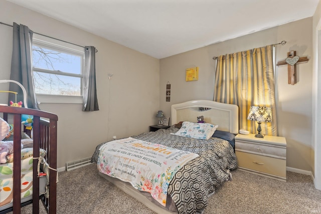 carpeted bedroom with visible vents and baseboards