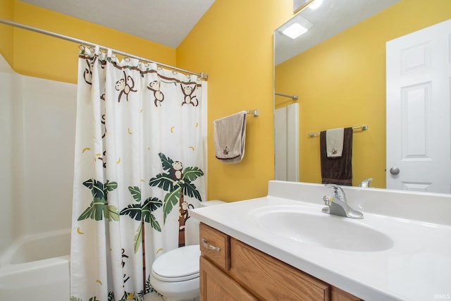 full bathroom with vanity, shower / tub combo, and toilet