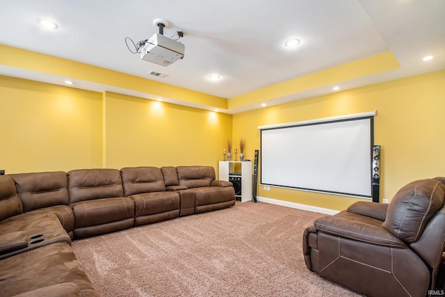 carpeted home theater with recessed lighting, visible vents, baseboards, and a tray ceiling