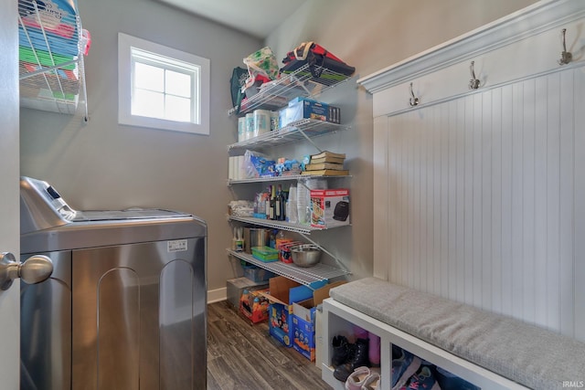 laundry area with dark wood-type flooring, laundry area, and washing machine and clothes dryer