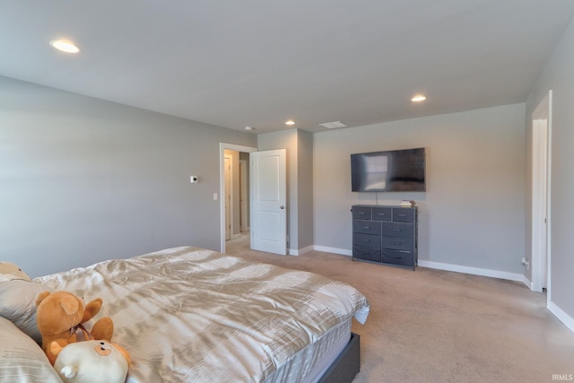 bedroom with recessed lighting, baseboards, and light carpet