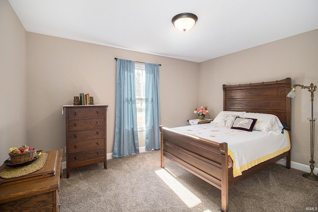 bedroom with baseboards and light carpet