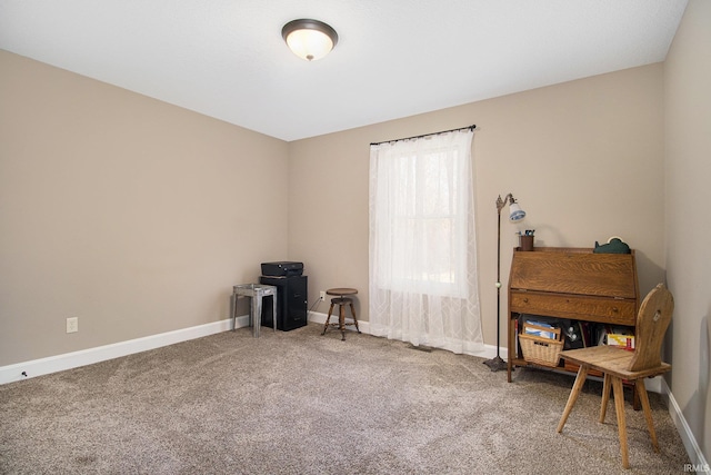 miscellaneous room with baseboards and carpet floors