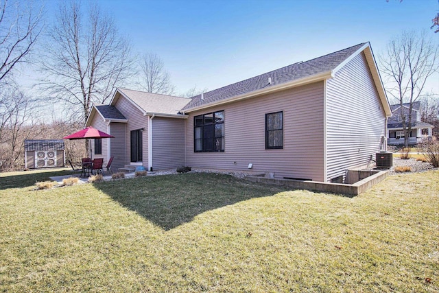 back of house featuring a patio, central air condition unit, and a lawn