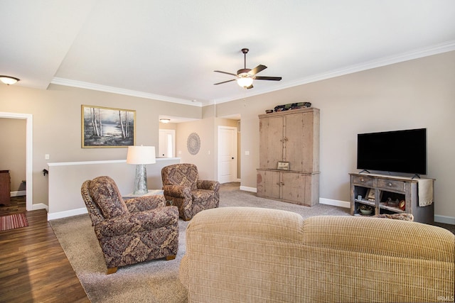 living area featuring crown molding, wood finished floors, a ceiling fan, and baseboards