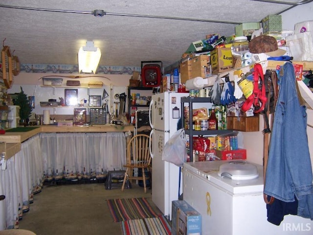 2685 S Knoll Dr, Macy, IN 46951 - interior space featuring concrete floors and freestanding refrigerator