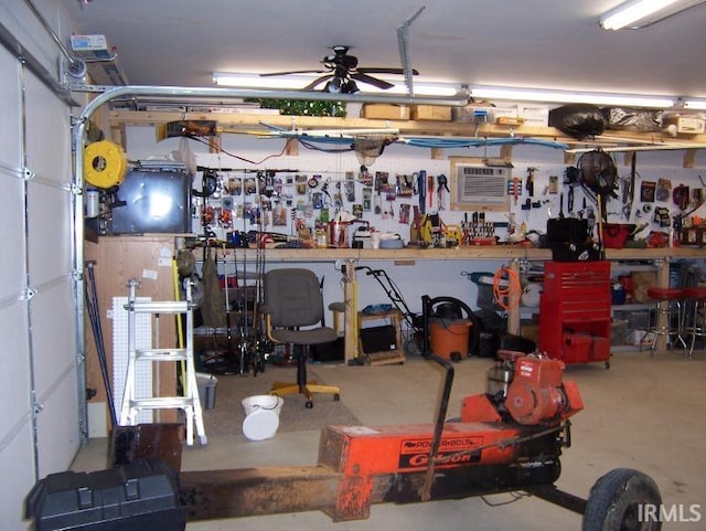 2685 S Knoll Dr, Macy, IN 46951 - garage with a workshop area, ceiling fan, and a wall unit AC