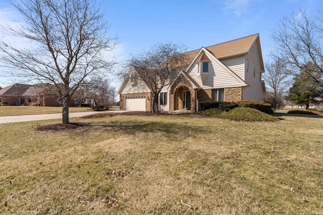 view of front of property with stone siding, a front lawn, and an attached garage