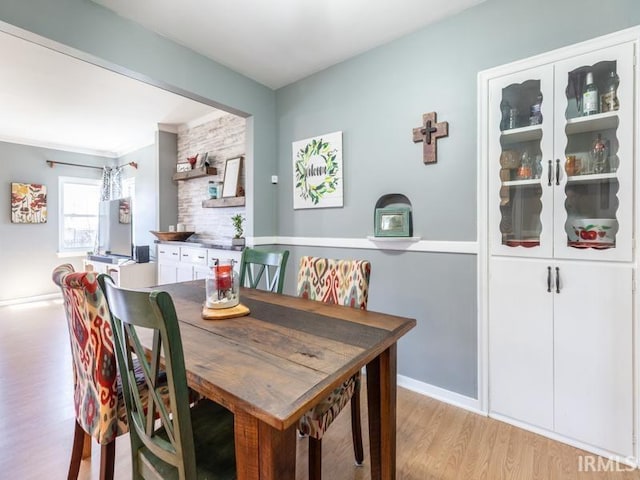 dining area with light wood-style floors