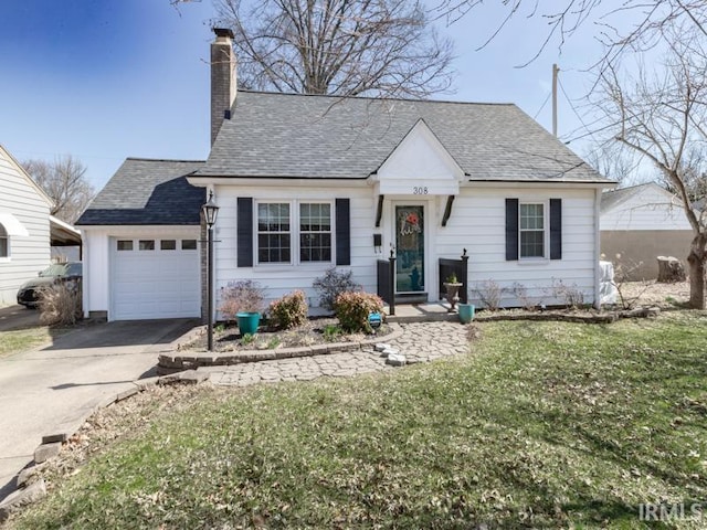 view of front of property featuring a front yard, roof with shingles, driveway, an attached garage, and a chimney