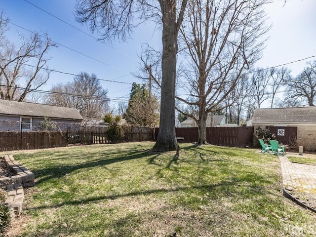 view of yard with a fenced backyard